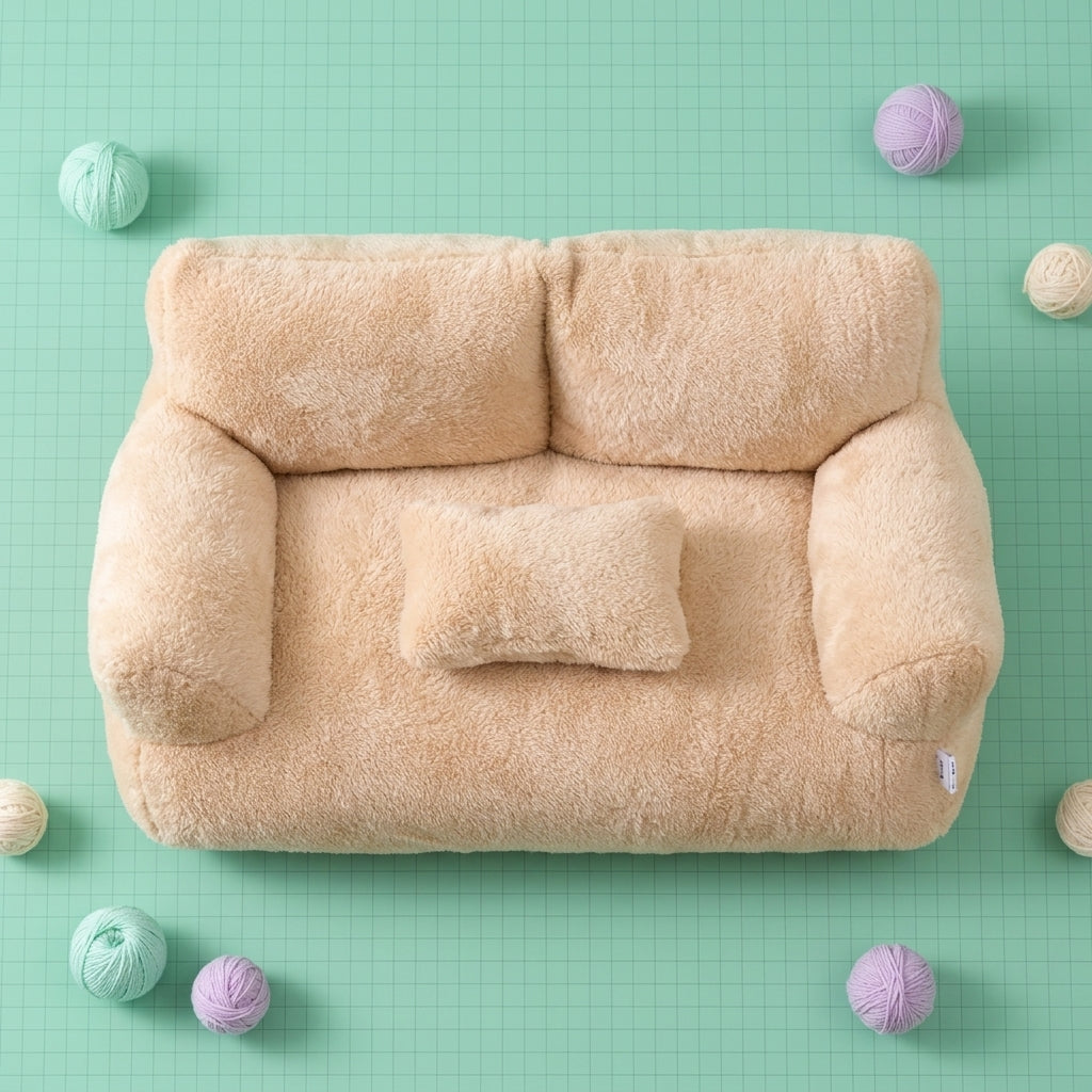Cat sofa bed in beige plush displayed on a mint green floor with decorative pom-poms, showing the raised sofa-style sides.