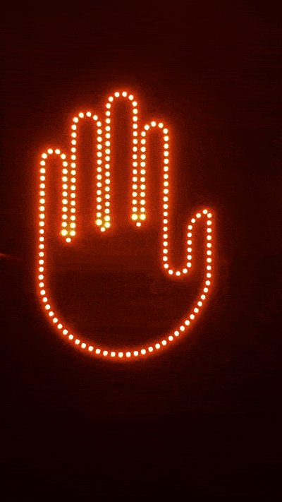 Hand signal for cars LED display cycling through all three gesture modes - wave, peace sign, and Love & Peace - in amber yellow LED.