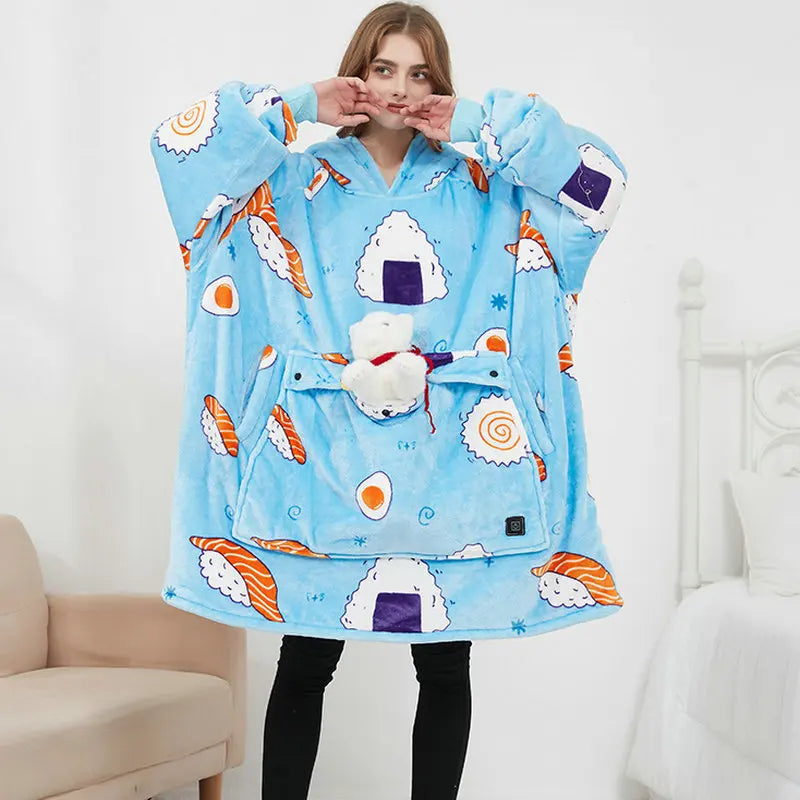 Woman wearing the oversized blanket hoodie in blue sushi, showing the full-length wearable blanket design with front pocket.