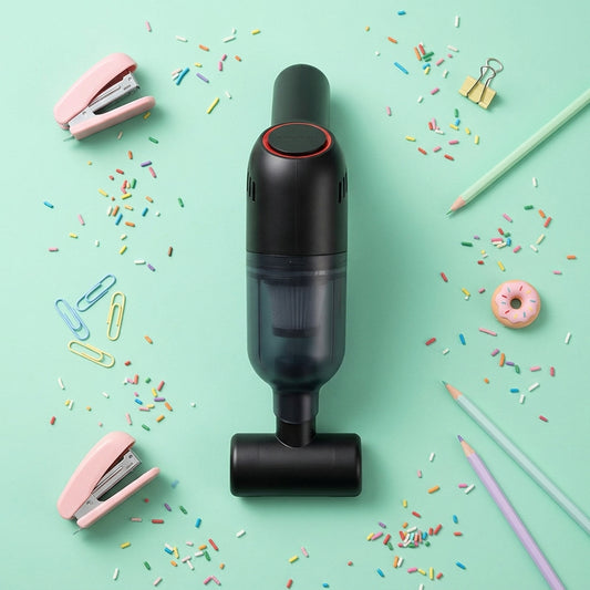 Portable auto vacuum cleaner in black shown with accessories on a bright background, highlighting the compact cordless design.